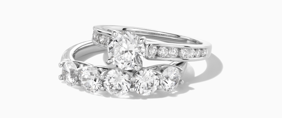 A pair of silver diamond rings.
