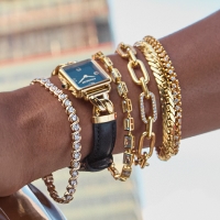 Woman wearing layered bracelets