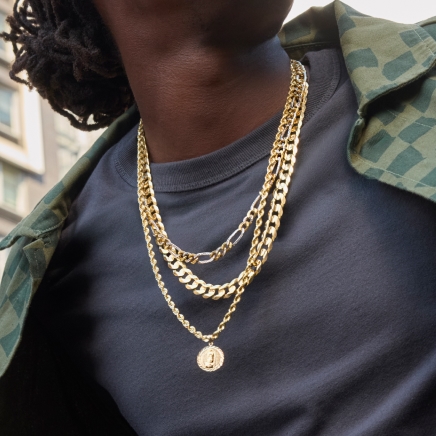 Man wearing gold chains from KAY