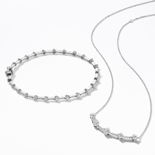 Woman wearing diamond Milestones necklace from KAY