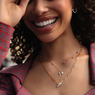 Woman wearing layered STUDIO BY KAY necklaces