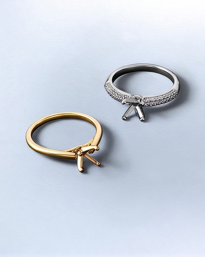 Engagement ring settings on blue background
