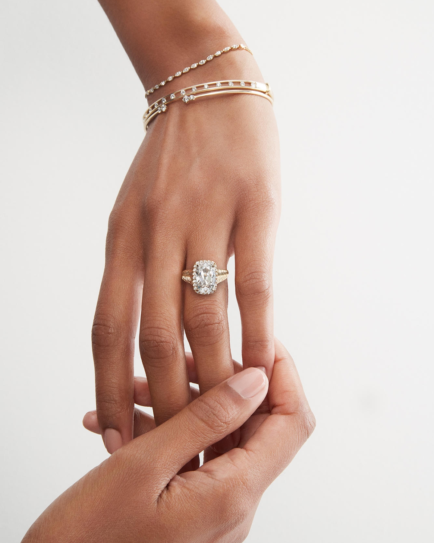 Woman wearing diamond jewelry from KAY