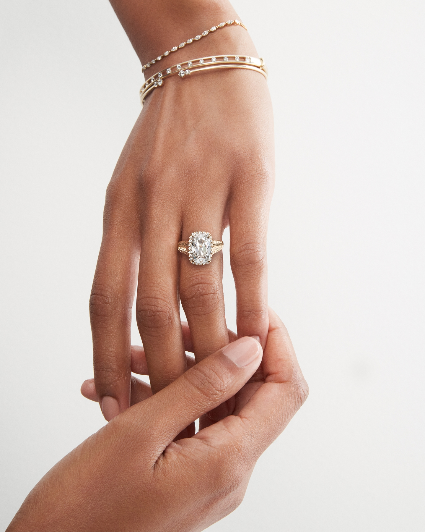 An out stretched hand wearing KAY diamond jewelry