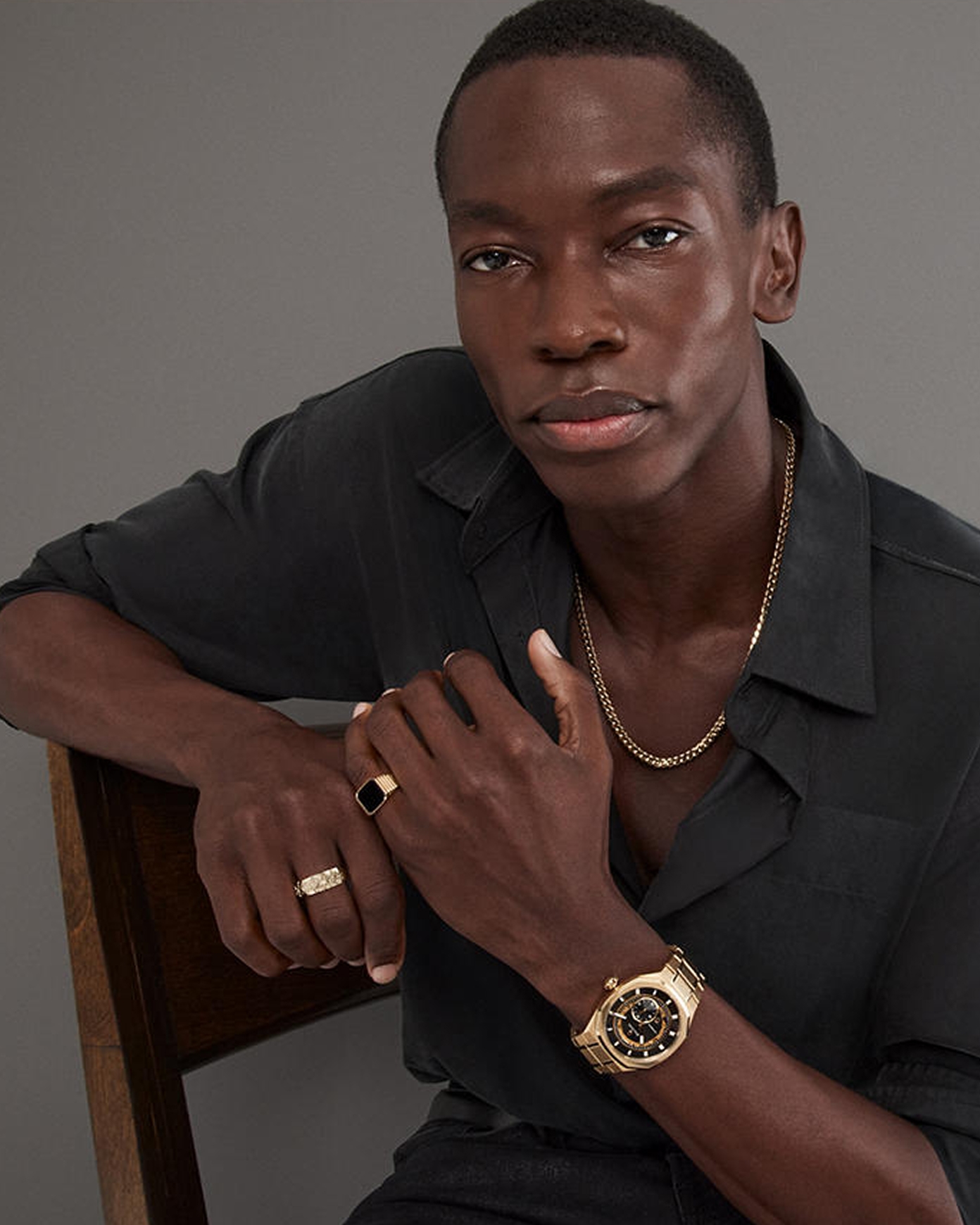 Men wearing a silver necklace and ring from KAY