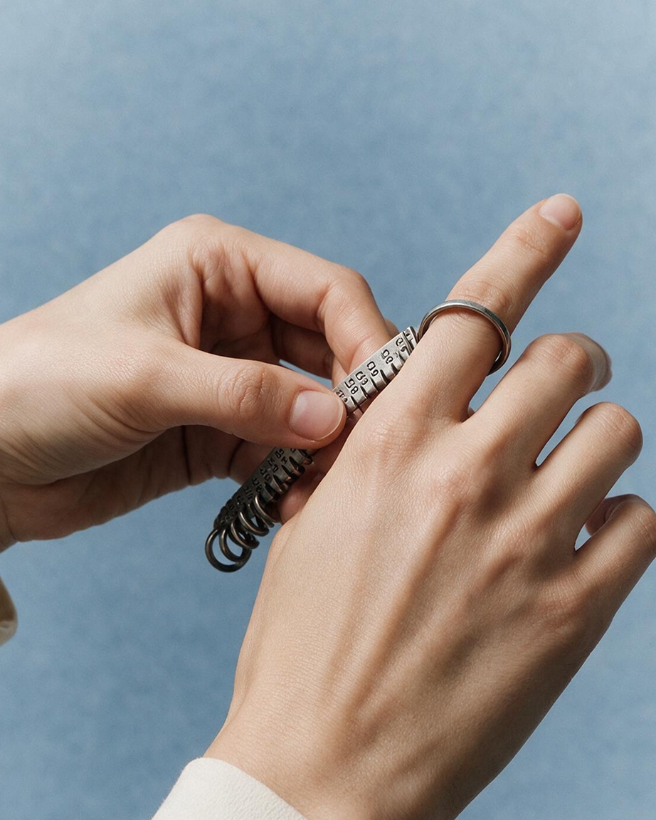 Woman using a ring sizer