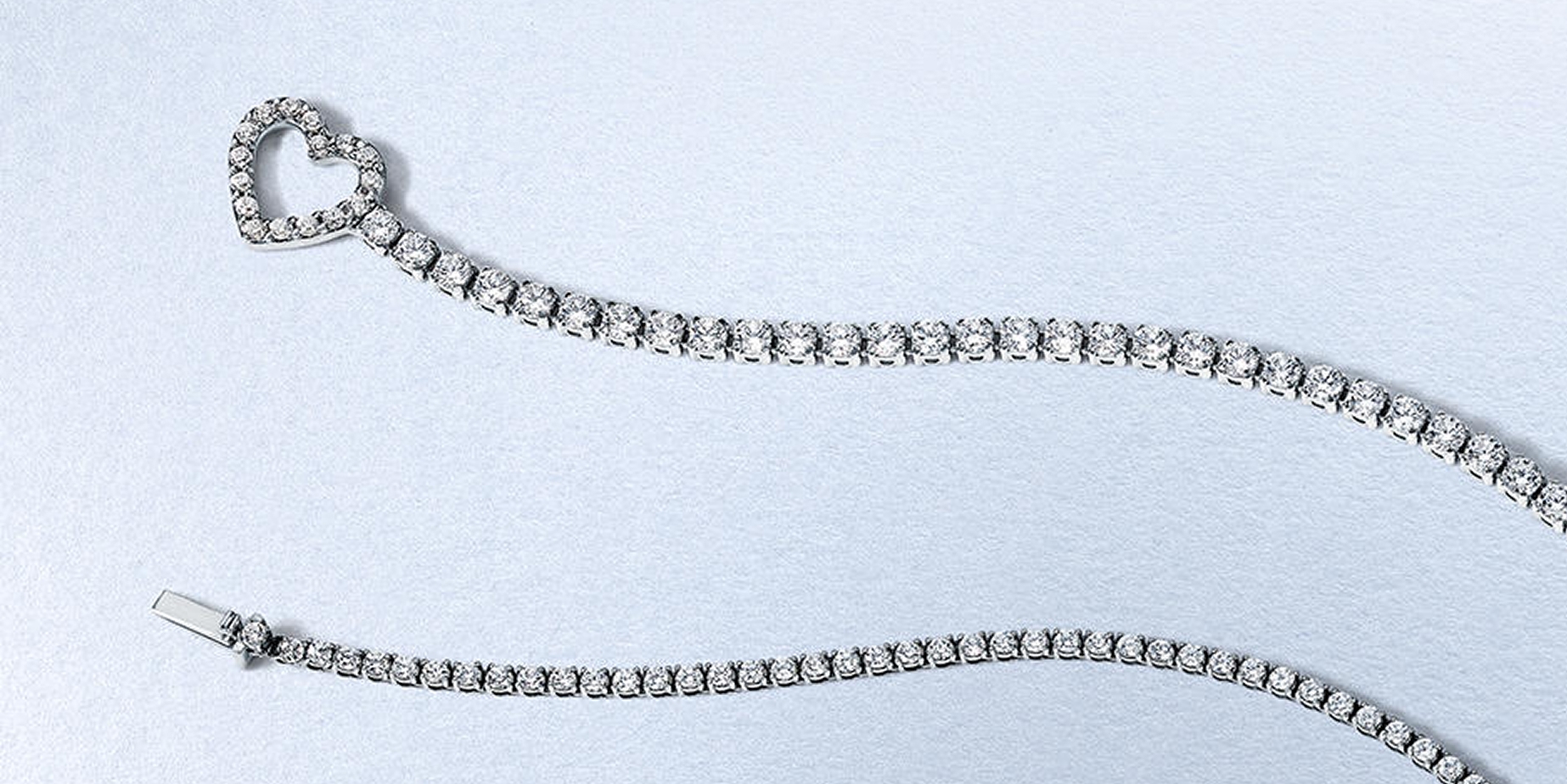 Tennis bracelet with heart clasp from KAY