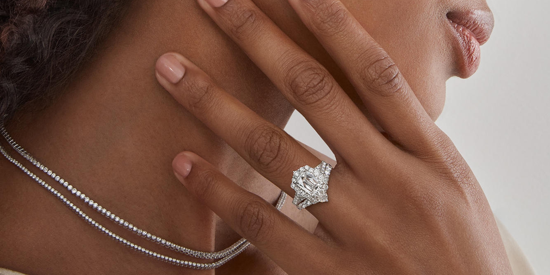 Woman wearing lab-grown diamond jewelry from KAY