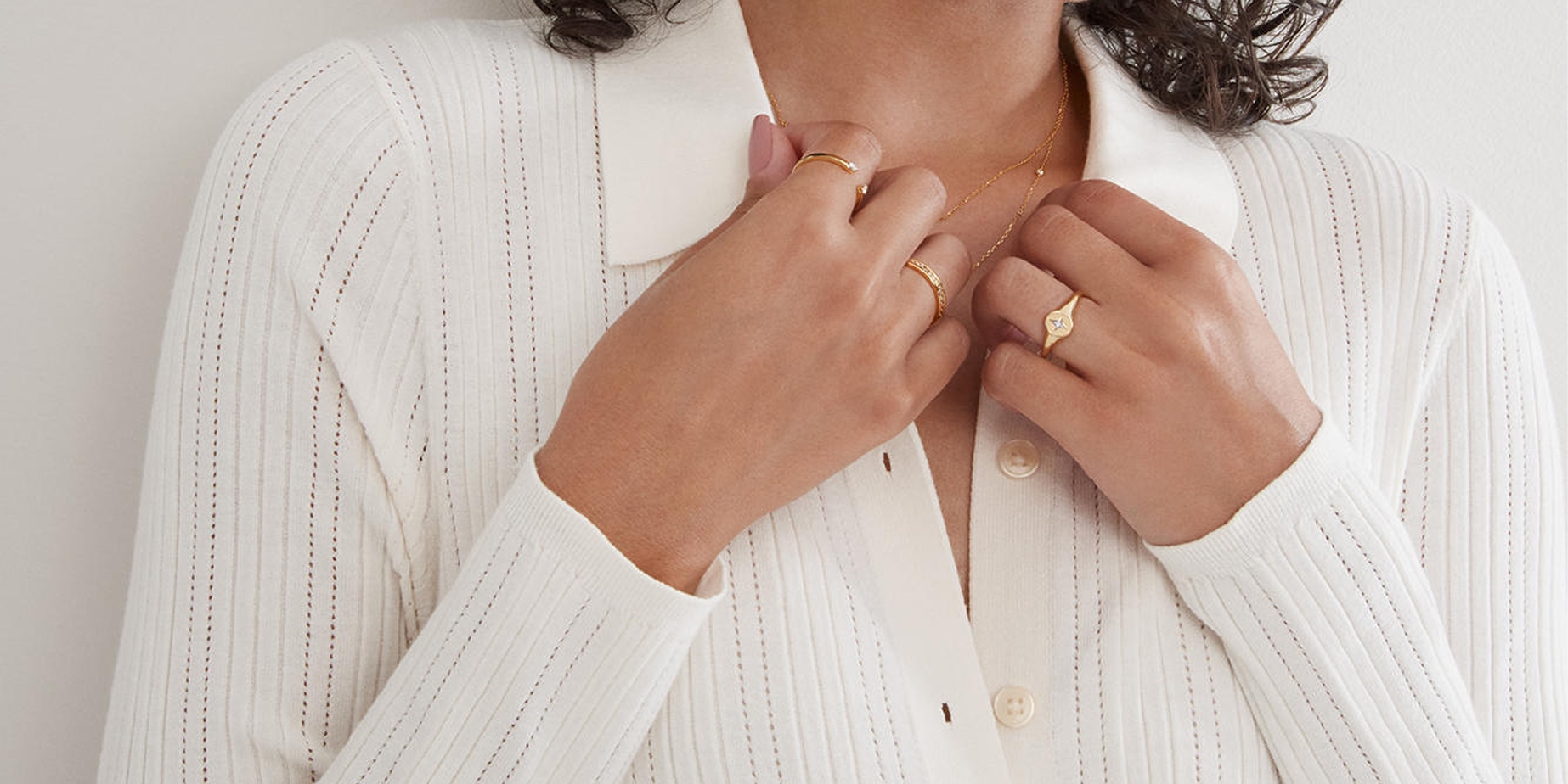 Woman wearing Rocksbox gold jewelry from KAY