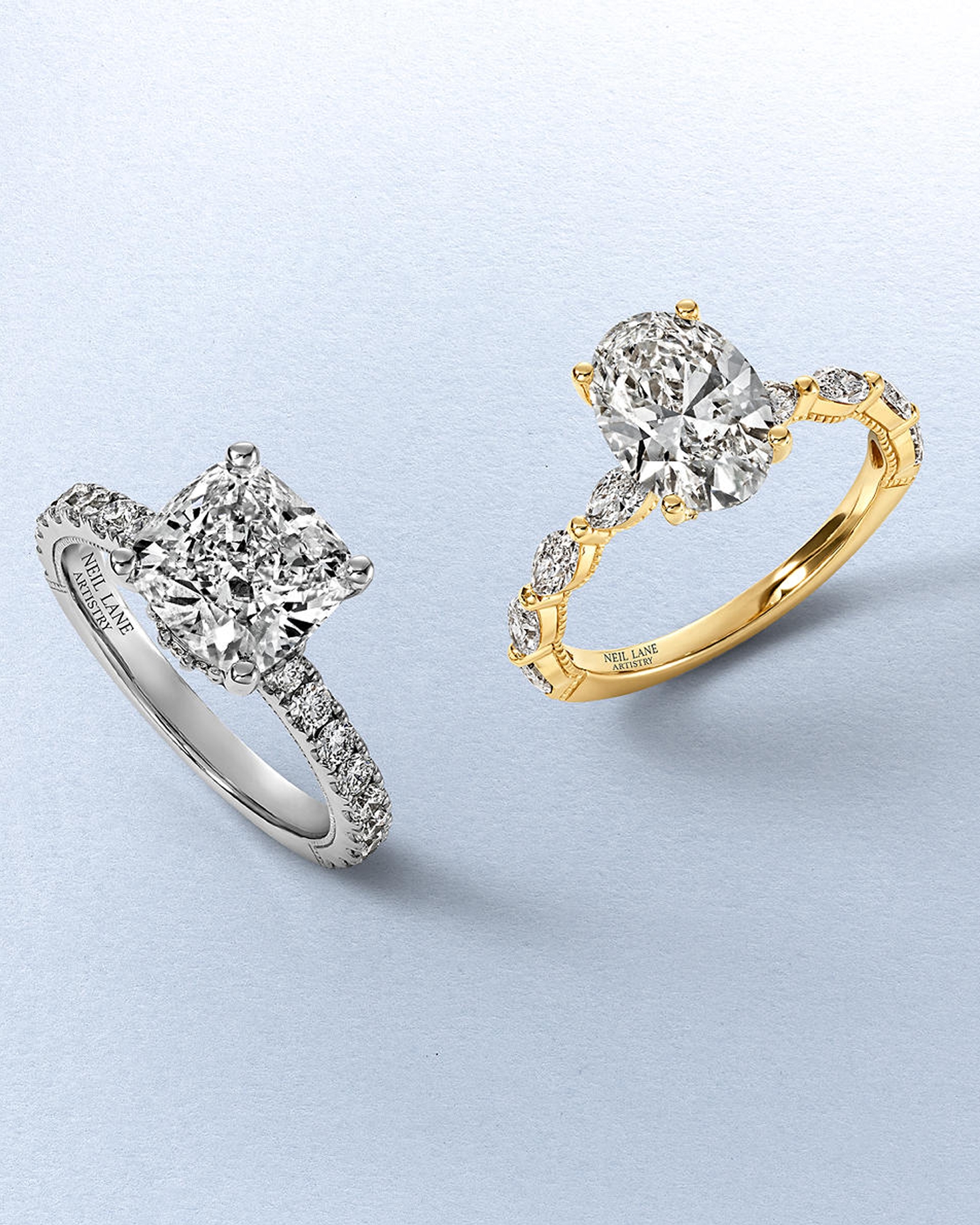 A gold diamond engagement ring, and a silver diamond engagement ring by Neil Lane Artistry from KAY.