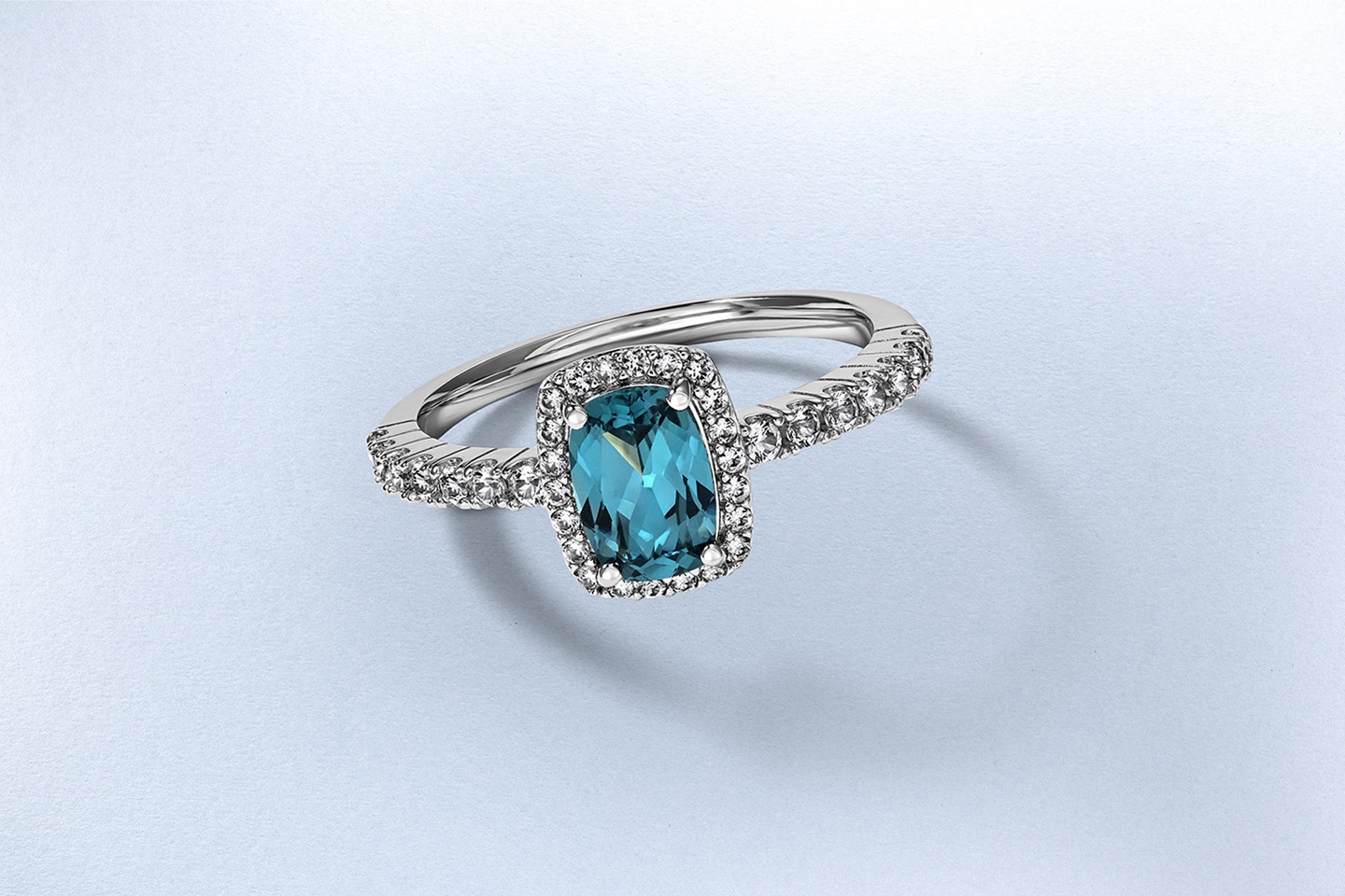 Two silver, gemstone inlaid engagement rings from KAY.