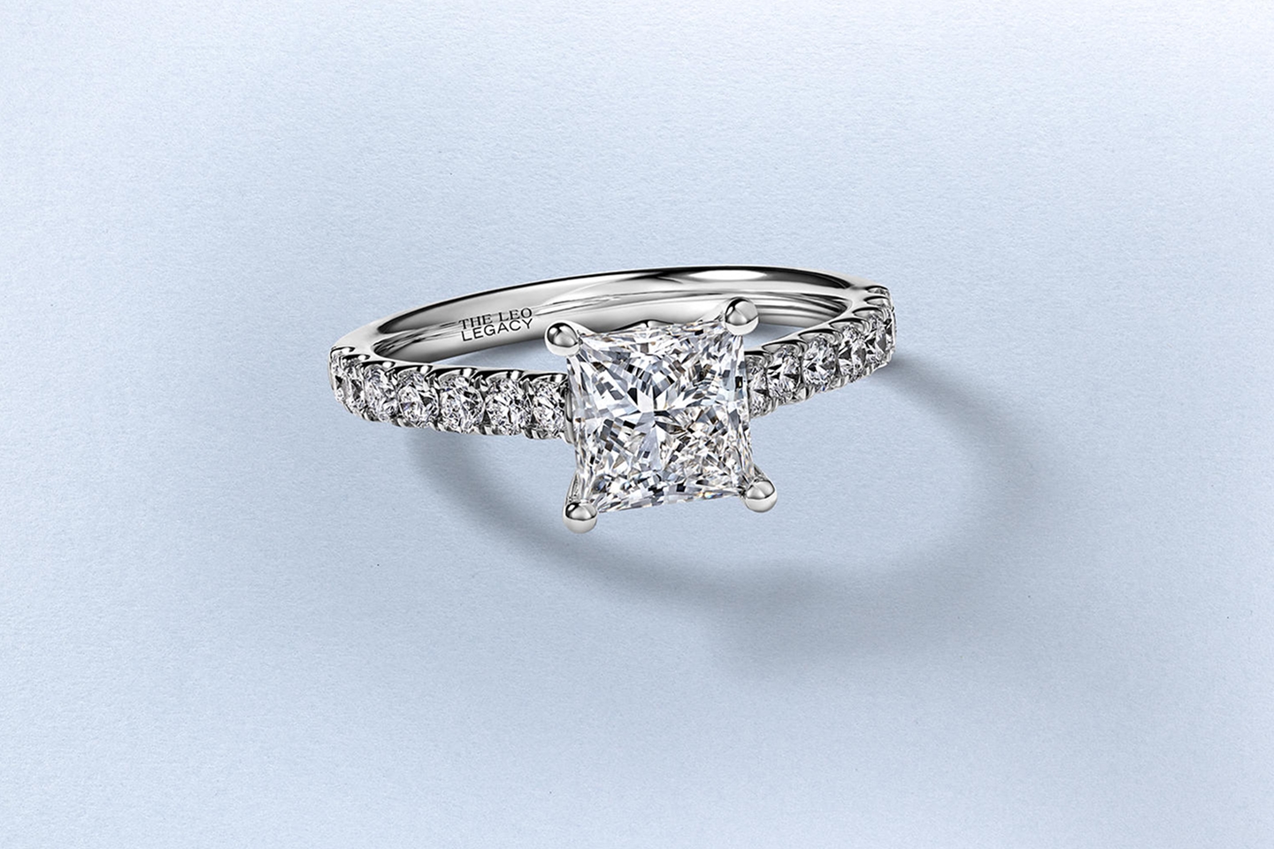 An emerald-cut, multi-stone, diamond engagement ring by KAY.