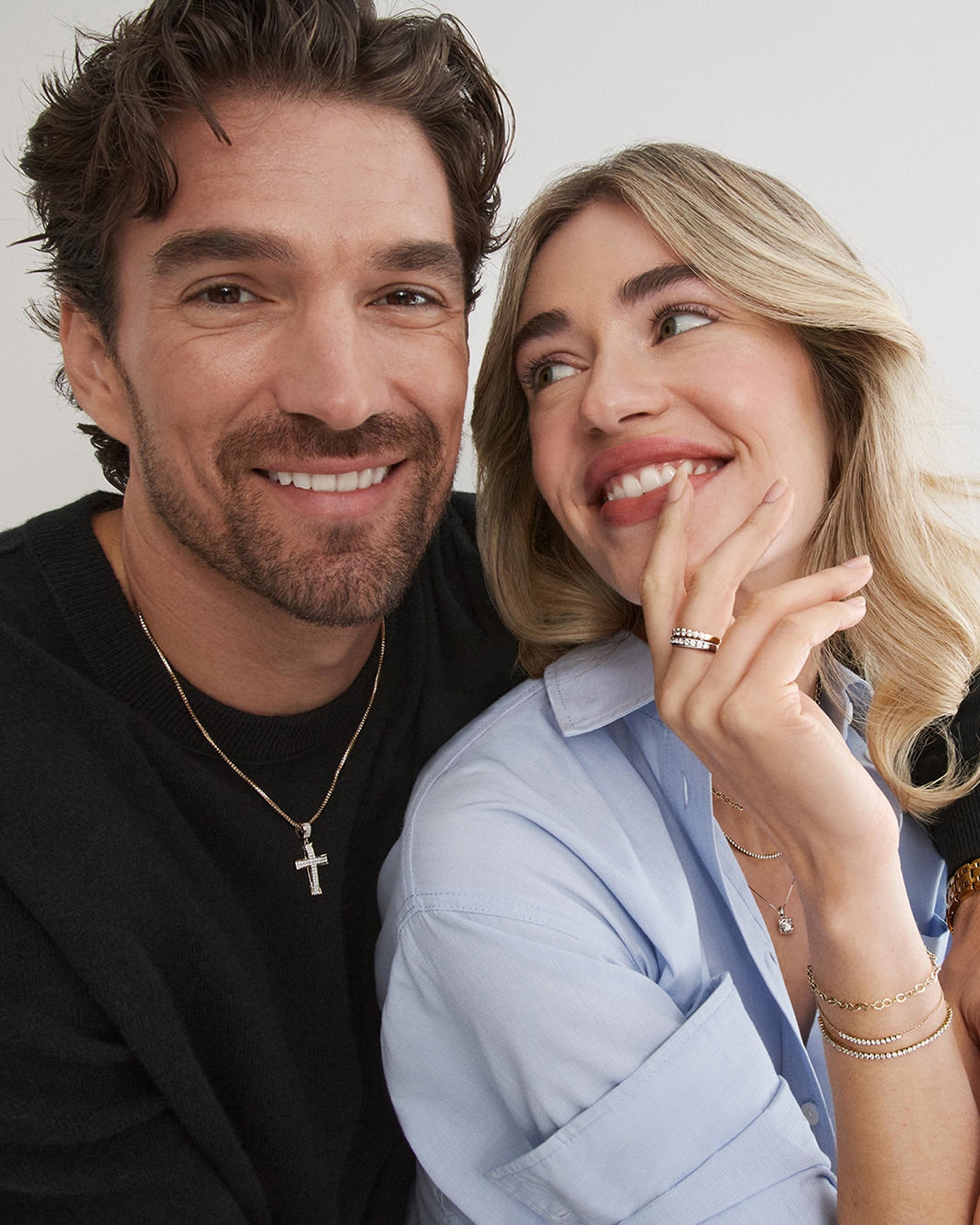 Woman and man wearing jewelry from KAY
