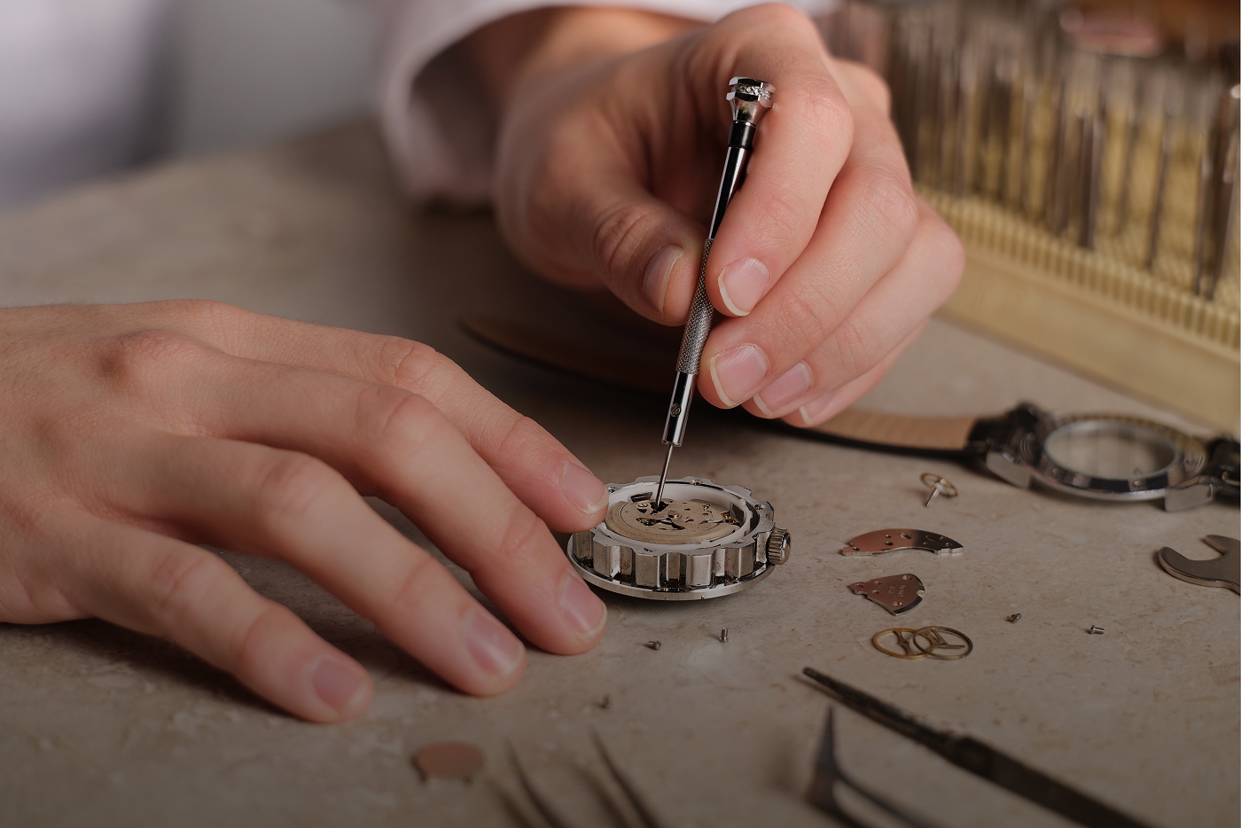 Jeweler repairing a watch