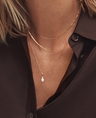 Woman wearing several necklaces