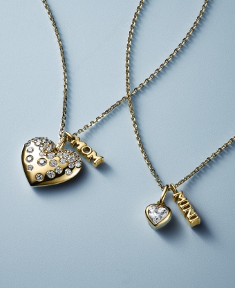 Two gold diamond heart necklaces