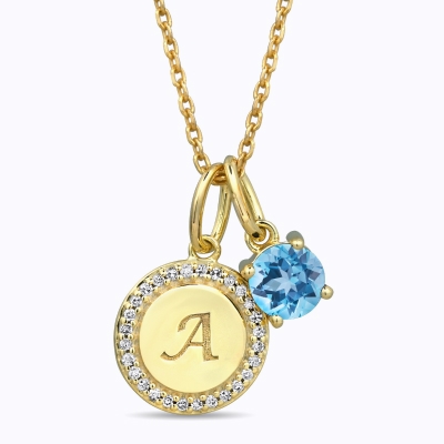 Image of gold necklace with A and blue gemstone charms