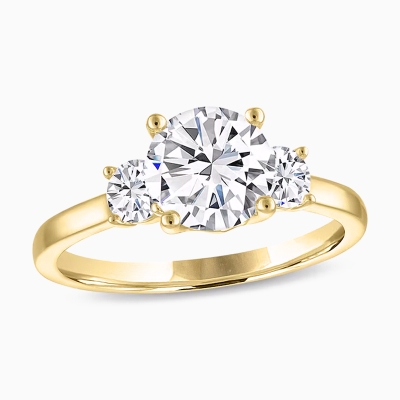 Image of gold three stone engagement ring