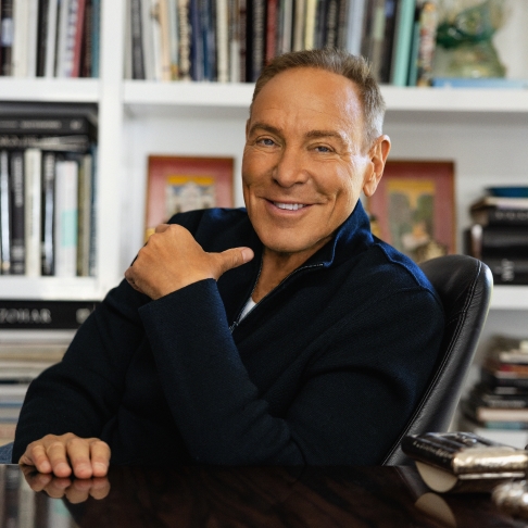 Neil Lane sitting at his desk smiling