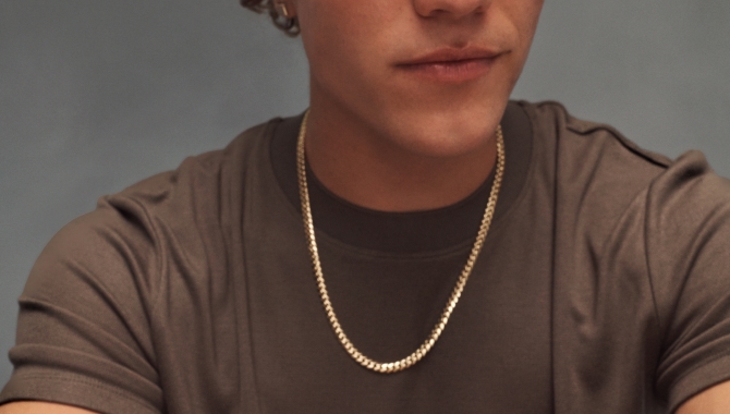 Man decked out in trendy men's jewelry from KAY