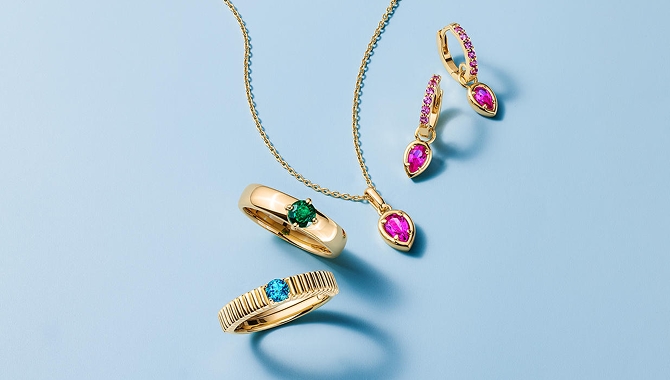 A gold diamond, pendant, necklace and gemstone earrings from STUDIO BY KAY.