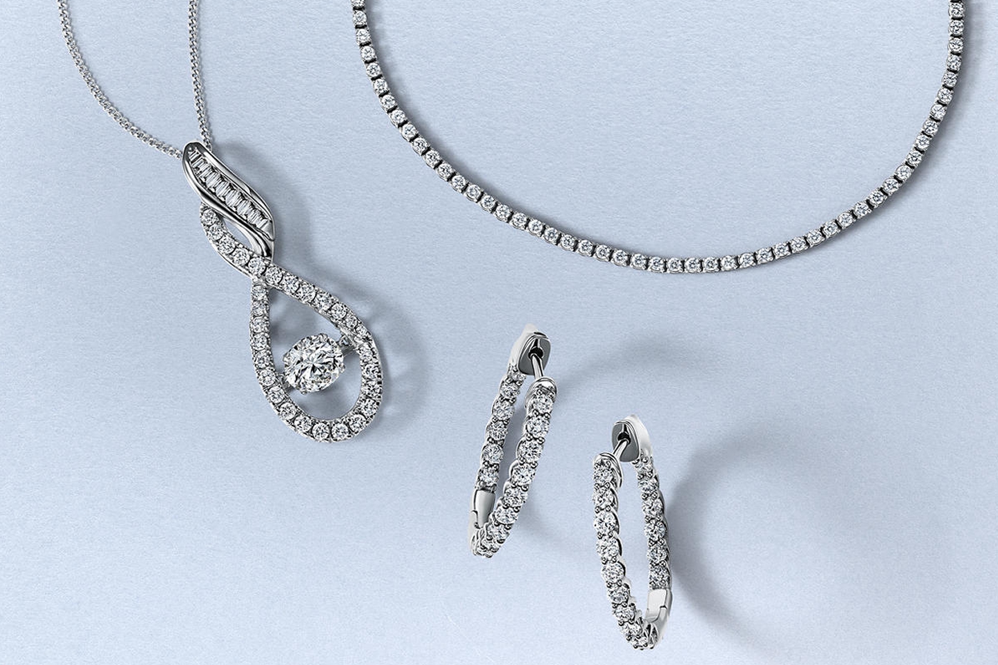 Diamond tennis bracelet, diamond necklace and hoops