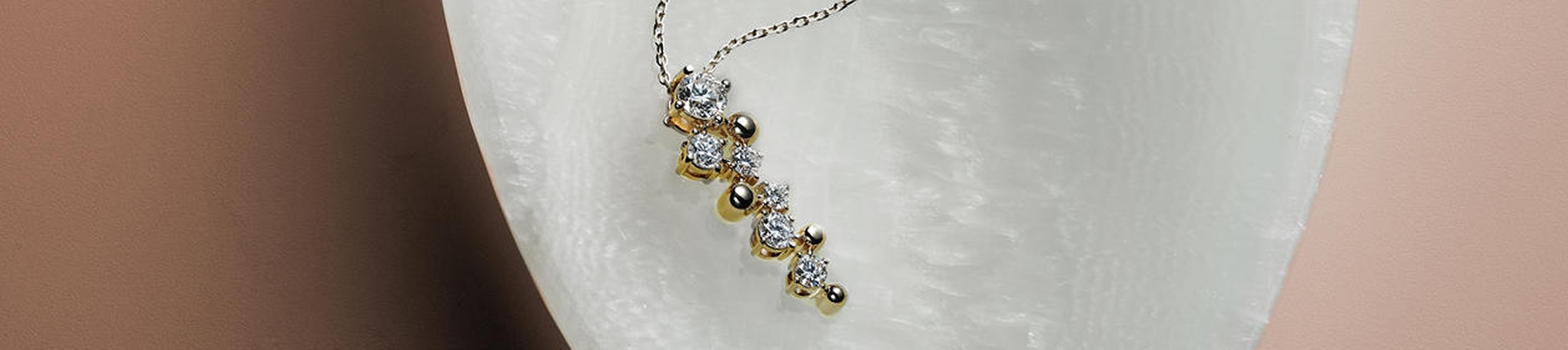 Close up of Jouje gold diamond necklace