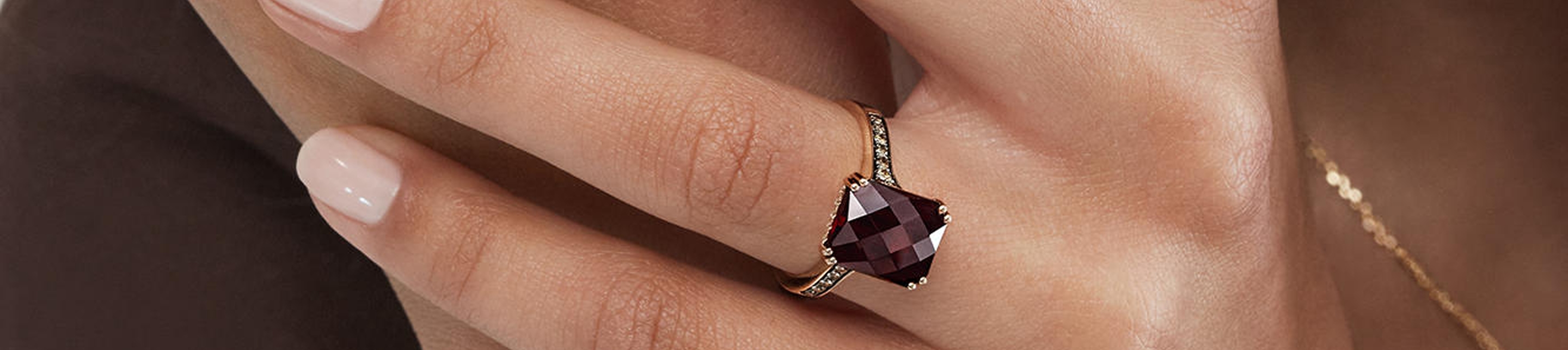 Close up shot of hand wearing Le Vian Chocolate Diamond emerald cut ring
