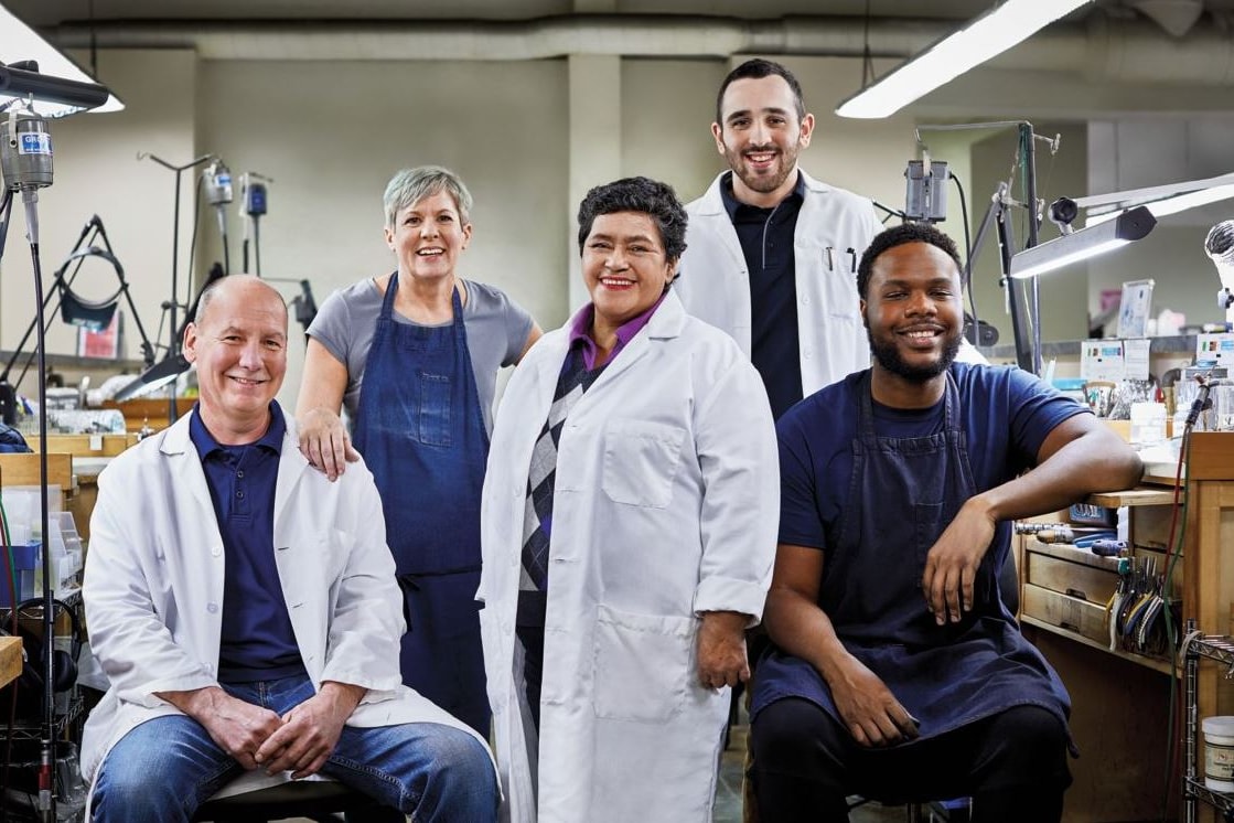 Image of several jewelers posing in studio