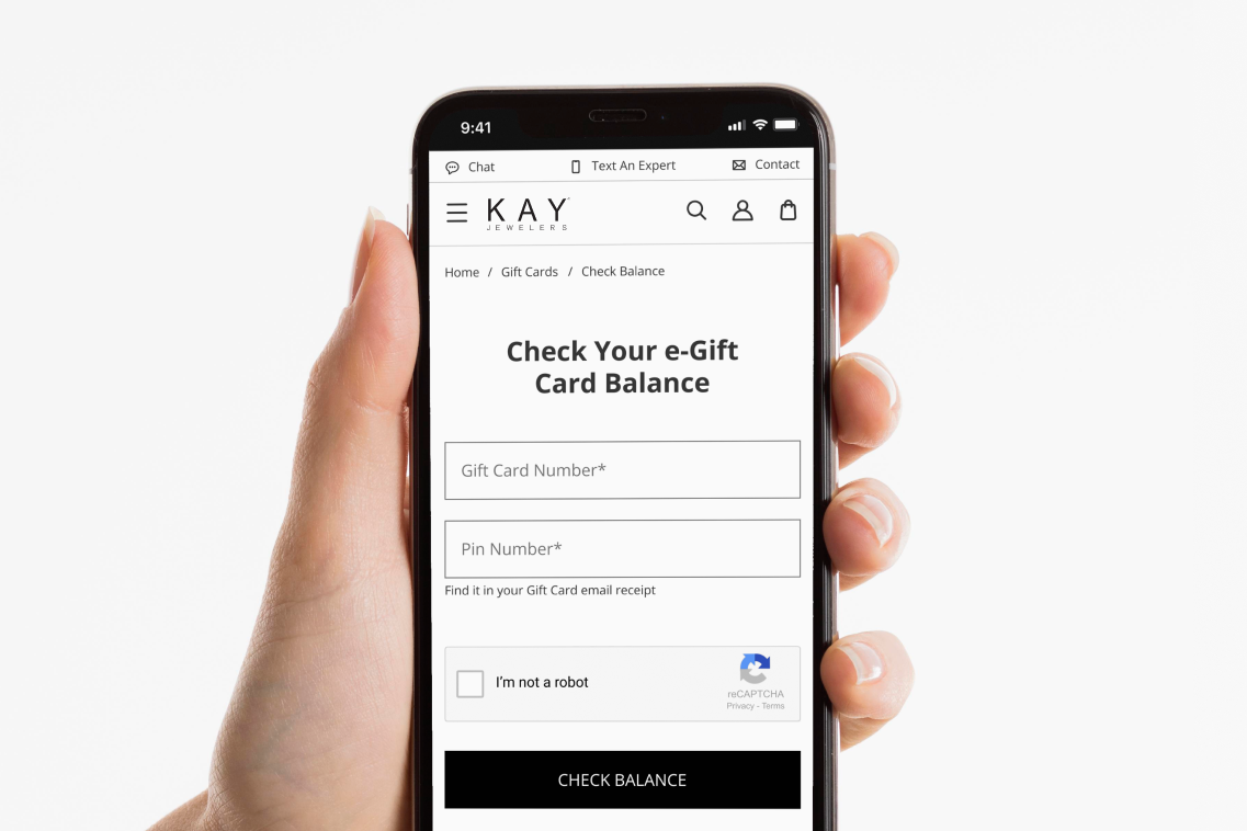 Image of hand holding phone showing Check e-Gift Card Balance screen