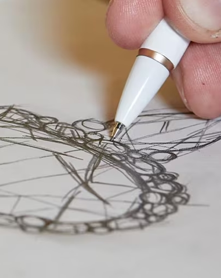 Close up of hand sketching ring