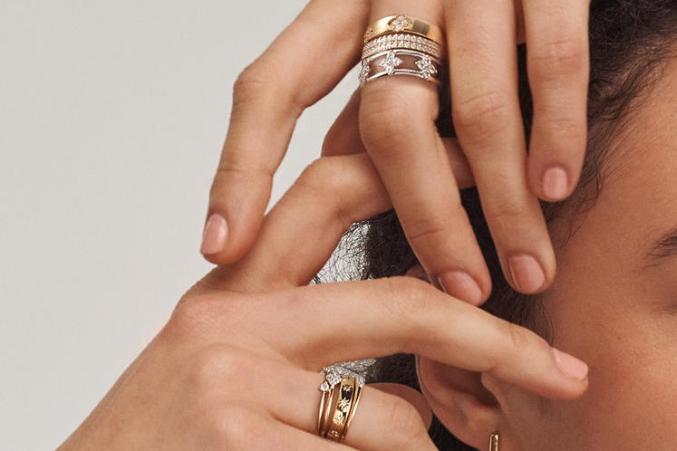 Image of hands wearing rings stacks