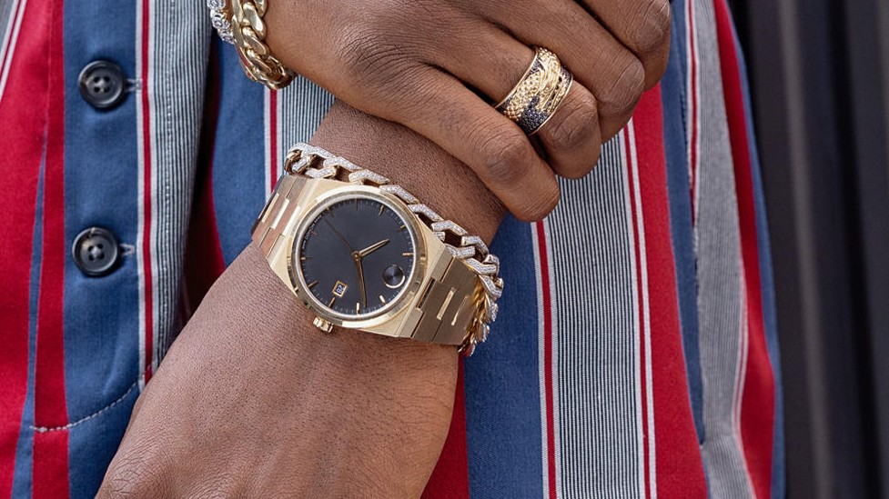 Men wearing gold plate watch with diamond bracelet and gold ring