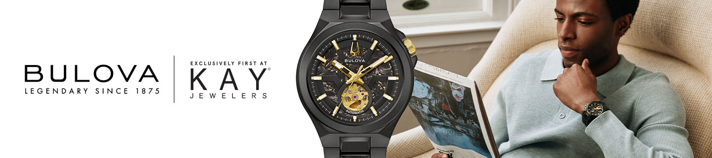 Man wearing new Bulova Maquina automatic watch while reading newspaper