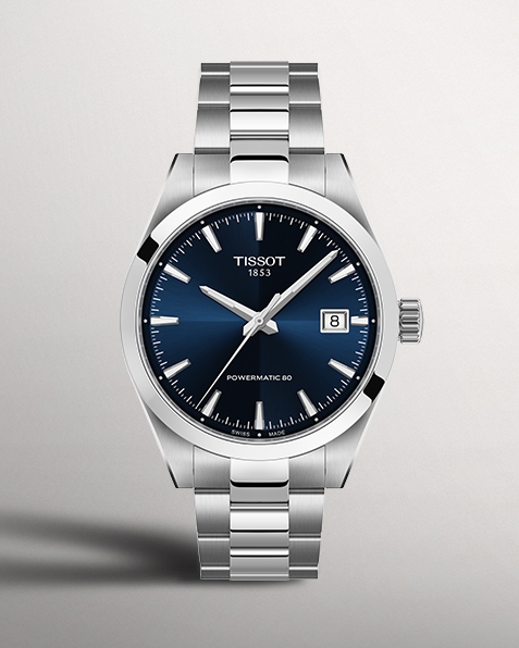 Tissot Gentleman watch with navy watch face on gray background