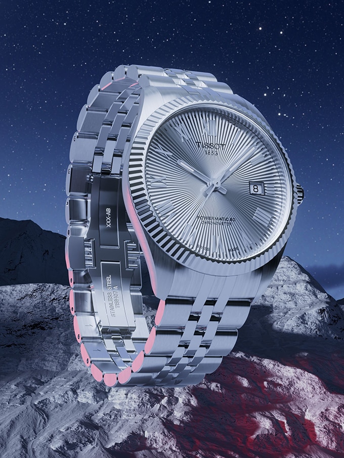 Tissot PRX watch on mountainous background