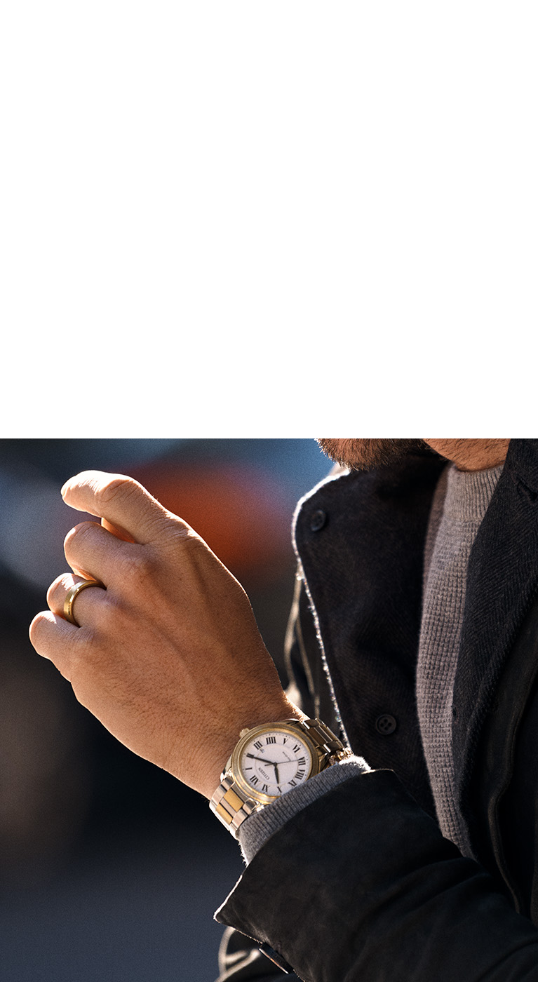 gold watch on wrist
