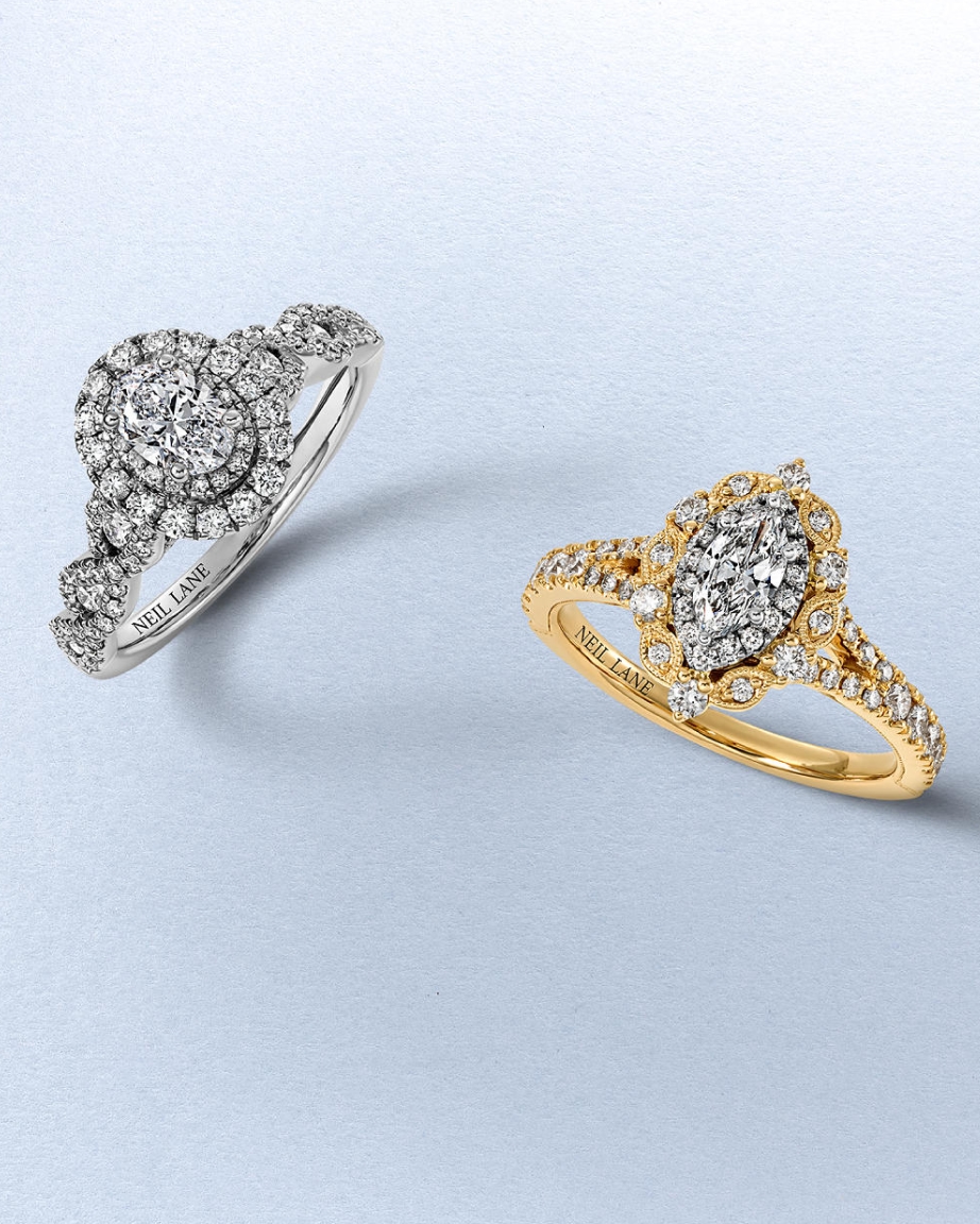 Kay Neil Lane diamond engagement rings featuring a round-cut halo diamond ring in white gold and an oval-cut halo diamond ring in yellow gold, showcasing intricate vintage-inspired details and exceptional brilliance.