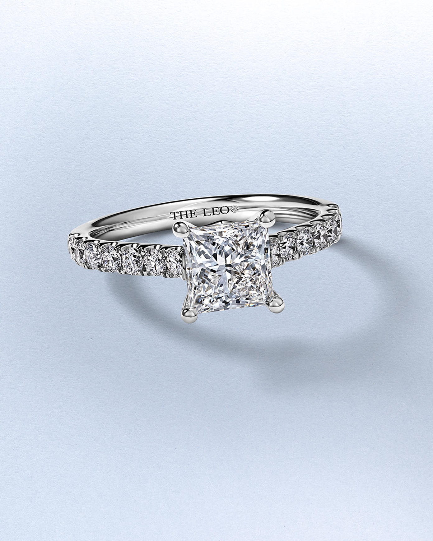 Kay Leo Legacy princess-cut diamond engagement ring featuring a square-cut center diamond, pavé-set diamond band, and signature Leo Diamond craftsmanship in polished white gold